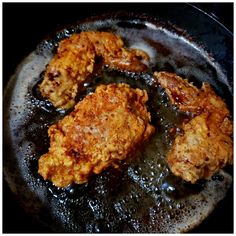 some fried food is cooking in a skillet