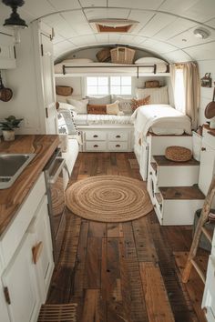 the interior of a tiny home with wood flooring