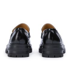 Stand-out from the crowd with our Wiz loafer. Showcasing a shiny black leather exterior, this design features an exaggerated chunky sole with a sleek rounded toe-shape, a high-cut vamp and is finished with a leather upper, lining and cushioned foot-bed. -Material: Leather Upper & Lining -Sole: Man-Made -Fit: We recommend choosing a half size down -Toe-shape: Rounded -Features: Chunky sole -Heel: 4.5cm Black Platform Loafers For Office, Black Vibram Sole Platform Loafers For Business, Black Business Platform Loafers With Vibram Sole, Classic Black Platform Loafers With Vibram Sole, Black Loafers With Lug Sole And Plain Toe, Black Leather Platform Loafers With Vibram Sole, Modern Black Platform Loafers With Chunky Sole, Modern Black Platform Loafers With Chunky Platform, Modern Business Platform Loafers With Contrast Sole