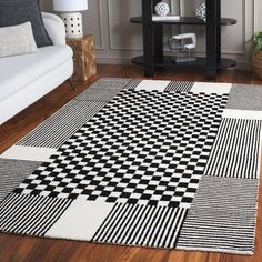 a black and white area rug in a living room