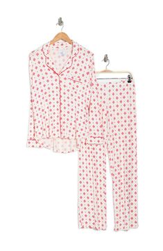 A soft jersey knit pajama set with a pretty print delivers feminine style and essential comfort. 2-piece set Shirt: 25" length (size S); Pants: 9.5" rise, 32" inseam (size S) Shirt: notch lapel, long sleeves, front button closures, chest patch pocket, allover print, contrast piping, knit construction Pants: elasticized waist, pull-on style, allover print, knit construction 95% rayon, 5% spandex Machine wash cold Imported Model’s stats for sizing: 5’11” height, 32” bust, 24” waist, 34” hips. Mode White Relaxed Fit Sets For Pajama Party, White Printed Loungewear Sets, White Printed Long Sleeve Sleepwear, Printed Relaxed Fit Sleep Sets, Printed Sets With Relaxed Fit For Sleep, White Long Sleeve Relaxed Fit Sleepwear, Printed Sets With Relaxed Fit For Lounging, White Relaxed Fit Sets For Sleepover, White Matching Set Sleepwear For Lounging