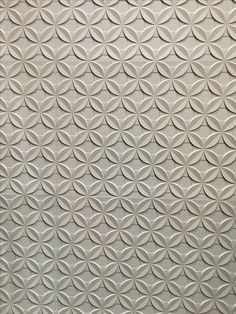 a white wall with many circles on it