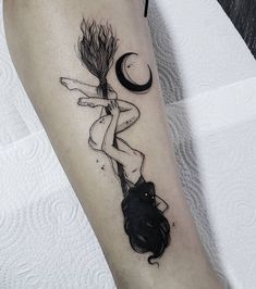 a woman with a broom on her leg is depicted in this artistic tattoo art design