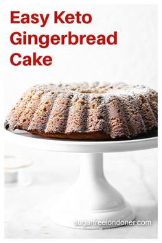 an easy keto gingerbread cake on a white cake stand with text overlay