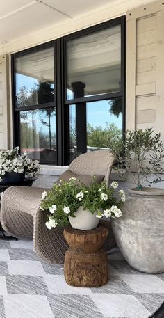 the front porch is clean and ready for us to use as an outdoor seating area