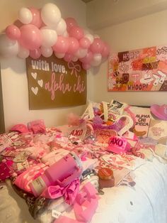 a bed covered in lots of pink and white balloons next to a sign that says with love, affair club