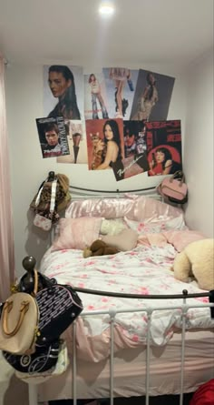 there is a bed with pictures on the wall above it