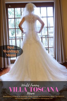 a woman in a wedding dress is standing by a window with the words world famous villa toscana on it