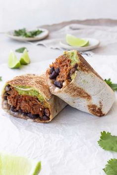 a burrito cut in half on top of a table