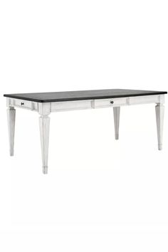 a white and black table with two drawers on each side, in front of a white background