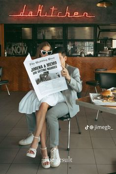 a woman sitting in a chair holding up a newspaper with the caption, daffitchen