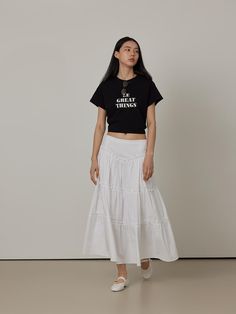 This product is a Cotton Cancan Tiered Long Skirt, meticulously designed to offer a flowing, feminine aesthetic. The skirt features multiple tiers that add volume and graceful movement with each step. Made from soft cotton, this piece ensures comfort and breathability, making it suitable for both casual and more dressed-up occasions. - The long skirt is structured with several layers, creating a full and dynamic silhouette that captures a romantic style.- Crafted from pure cotton, the fabric is both soft and lightweight, ideal for keeping cool during warmer months.- Its elastic waistband allows for a flexible fit, accommodating various body sizes comfortably.- The all-white color enhances its versatility, allowing it to be paired with a wide range of top styles and colors. Casual Tiered Maxi Skirt With Layered Hem, Casual Relaxed Maxi Skirt With Layered Hem, Ruffled Cotton Maxi Skirt, Flowy Cotton Tiered Maxi Skirt, Cotton Maxi Skirt With Ruffle Hem For Spring, Relaxed Long Skirt With Layered Hem, Casual Cotton Skirt With Layered Hem, Voluminous Long Skirt With Layered Hem, Cotton Tiered Maxi Skirt