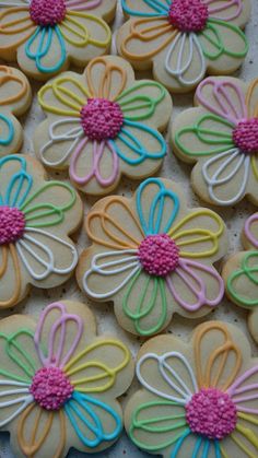 some decorated cookies are sitting on a table