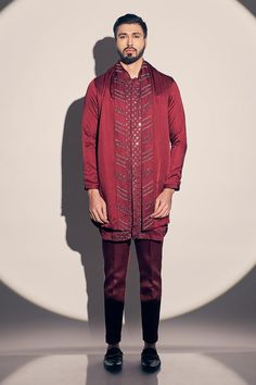 Maroon kurta with placed cutdana embroidered floral patterns. Comes with pant and dupatta.
Components: 3
Pattern: Embroidered
Type Of Work: Cutdana, Sequin
Neckline: Mandarin Collar
Sleeve Type: Full
Fabric: Satin linen, Lining: Satin
Color: Maroon
Other Details: 
Attached lining
Side pockets
Closure: Kurta: Front concealed placket
Occasion: Sangeet,Cocktail - Aza Fashions Kurta Pant Set, Types Of Work, Kurta With Pants, Satin Color, Pant Set, Floral Patterns, Mandarin Collar, Aza Fashion, Sleeve Type