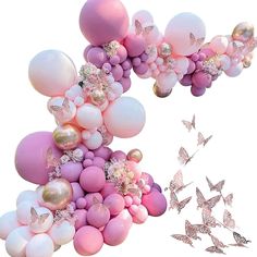 some balloons and butterflies are flying in the air with pink, white and gold colors