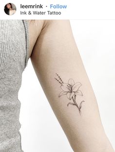 a woman's arm with a flower tattoo on the left side of her arm