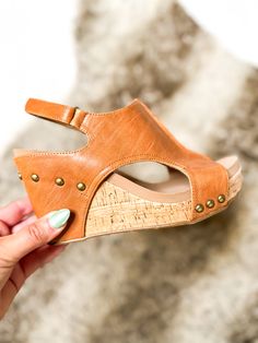 Our beloved wedge got a sassy upgrade! With the smooth cognac this is perfect for any outfit for a night out. The velcro strap helps with easy accessibility getting these on and off. These have a taller heel than our famous Carley wedge - these have a 4 inch heel with a 1 inch platform. The cushion helps still provide you an incredible amount of comfort even with that taller heel. True to size. If you're a half size with a wider foot, size up. If you're a half size with a narrow foot, size down. 4 Inch Heels, Velcro Straps, A 4, Cognac, 1 Inch, 4 Inch, Night Out, Wedges, Thing 1