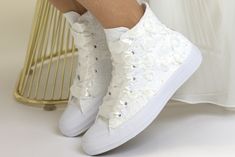 New faster production time.Everything is shipped in 1-2 weeks. Made with love for your wedding day by Lovin Bridal - More Wedding shoes at our shop : http://lovincollection.etsy.com High Top Wedding Sneakers For Bride, Bridal Trainers With Flowers, Bridesmaid Tennis Shoes, Converse High Top It's the bride's prerogative to wear the comfiest wedding shoes. If you're set on heels then one option is to have your High Top Lace Bridal Chuck Taylor as a second pair of bridal shoes to change into for th Spring Wedding High-top Sneakers, Spring Wedding Sneakers With Round Toe, White Flat Heel Wedding Shoes For Bridal Shower, White Lace-up Wedding Shoes For Bridal Shower, Bridal Trainers, Sneakers For Bride, Wedding Sneakers For Bride, Comfy Wedding Shoes, Color Converse