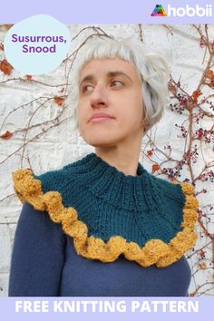 a woman with white hair wearing a blue sweater and yellow crochet ruffled collar