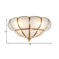 a flush light fixture with three lights on each side and an oval glass shade in the middle