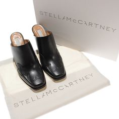 Stella Mccartney Black Designer Mules With Contrasting Heel For Work, Designer Mules With Reinforced Heel, Stella Mccartney Sneakers, Stella Mccartney Shoes, Tan Ankle Boots, Embellished Flats, Boot Pulls, Women's Slip On Shoes, Wedge Ankle Boots