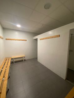 an empty room with benches in it