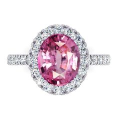 a pink sapphire and diamond ring with white diamonds on the band, set in 18k white gold