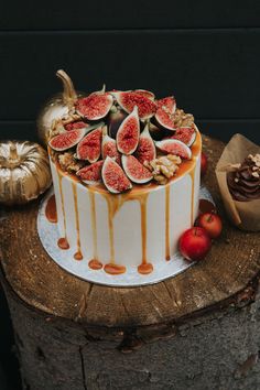 a cake with figurines and caramel drizzled on the top