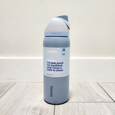 a water bottle sitting on top of a wooden floor