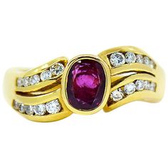 Ruby & diamond ring by Assor Gioielli. Beautiful oval shape red ruby set in a well crafted 18k yellow gold ring & flanked by two rows of round brilliant cut diamonds on both sides in a wave design. The approximately 0.75 carat Ruby measures approximately 6.00 mm x 5.00 mm. Total weight of diamonds is approximately 0.25 carats. This ring is size 7 and can be resized uppon request. Please allow 3 to 4 business days for re-sizing. Total gram weight 7.20 grams. Ring Specifications: Designer: Assor G