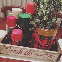 a wooden crate filled with lots of christmas items