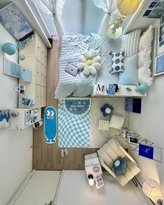 an overhead view of a bedroom with blue and white decor