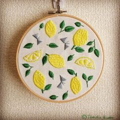 a embroidery project with lemons and leaves on it