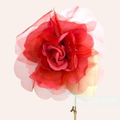 WOWZA! Meet 'Pricilla', by far our largest and most flamboyant millinery flower. Ideal for Royal Ascot, this giant Bright Red flower is made up of giant floaty organza and silk petals with velvet accent petals at it's centre. It's an absolute whopper of a flower!  Try putting two on a fascinator base or headband for an instant statement hat!  Flower measures: Width: Around 25cm (10 inches) when splayed out Length of wired stem: 9cm (3.5 inches) For our full range of velvet hat flowers visit our Red Handmade Flowers Fascinator For Wedding, Red Wedding Fascinator With Handmade Flowers, Red Summer Fascinator With Handmade Flowers, Summer Red Fascinator With Handmade Flowers, Red Handmade Flowers Fascinator For Spring, Red Handmade Flowers Fascinator For Summer, Red Flower Fascinator For Party, Sinamay Fabric, Statement Hat