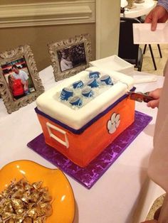 there is a cake that looks like a cooler on the table