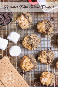 cookies and marshmallows on a cooling rack with text overlay that reads, s'mores cornflake clusters