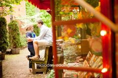 a man and woman are sitting on a bench