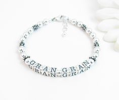 "Beaded Name Bracelet: Created with 4.5mm sterling silver alphabet blocks and loads of gorgeous sterling silver accent beads. The name on the bracelet can be hers, her child or grandchild's name, or something like Nana, Mimi, Grandma, Mommy, etc. The base price includes 6 letters. Each additional letter is $2. I can usually fit two names on the bracelet if desired. C H O O S E . Y O U R . C L A S P Twisted Heart Toggle Plain Heart Toggle Round Toggle Lobster Clasp with 1/2\" extender chain Arriv Classic Sterling Silver Bracelet With 8mm Beads Gift, Silver Charm Bracelet With Letter Beads, Classic Silver Beaded Bracelets As Gift, Silver Charm Bracelet With Letter Beads For Gift, Silver Charm Bracelet With Letter Beads As Gift, Classic Letter Beads Jewelry As Gift, Classic Letter Beads Jewelry Gift, Silver Beaded Bracelet With Letter Beads, Classic Beaded Bracelets With Sterling Silver Clasp As Gift