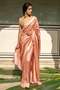 Blush pink silk banarasi saree with all over textured chevron pattern and broad metallic border. Comes with running blouse piece.
Components: 1
Pattern: Woven
Type Of Work: Chevron Pattern
Fabric: Silk Banarasi
Color: Maroon
Other Details: 
Note: The stitched blouse worn by the model is not for sale
Disclaimer: The joint fabric pieces may vary. Designers unique process ensures that the placement of fabric will always be similar but not same. They always create the product with stretch fabrics of Luxury Banarasi Silk Traditional Wear With Cutdana, Luxury Banarasi Silk Gown With Traditional Drape, Luxury Banarasi Silk Saree Gown, Luxury Bollywood Banarasi Silk Blouse Piece, Luxury Banarasi Silk Bollywood Sets, Luxury Slub Silk Choli For Saree, Luxury Bollywood Banarasi Silk Sets, Luxury Slub Silk Pre-draped Saree For Diwali, Luxury Traditional Slub Silk Pre-draped Saree