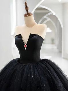 Introducing our Gothic Black V-neck Tulle Wedding Dress, featuring a ruby-adorned accent for a touch of royal elegance. Made from luxurious tulle fabric, this dress exudes sophistication and exclusivity. Perfect for the daring bride who wants a touch of dark fantasy on her special day. Formal Tulle Wedding Dress For Prom, Formal Tulle Wedding Dress For Prom Season, Elegant Tulle Ball Gown With Sweep Train, Elegant Tulle Ball Gown For Wedding, Elegant Tulle Wedding Dress For Gala, Elegant Wedding Ball Gown In Tulle, Gala Ball Gown With Tulle Skirt, Glamorous Tulle Wedding Dress For Gala, Formal Gown With Sweetheart Neckline And Tulle Skirt