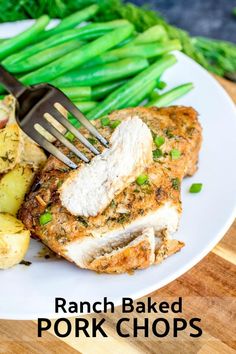 a white plate topped with pork chops and green beans