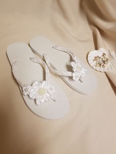 "Very simple Flat wedding sandals flipflop style 1/2\" heel. OFF-WHITE, ALSO CALLED DIAMOND WHITE. handmade flowers, the centers are a little darker than flowers; flowers are not white, flowers are Off-white. Very dressy and simple please look at the pictures. Sizes: Small: 5.5 - 6.5 Medium: 7-8 Large: 8.5 - 9.5, X-Large: 10 - 11 Please contact for any questions ON SIZING, or ANY other concerns. FINAL SALE, NO RETURNS, NO EXCHANGES, NO EXCEPTIONS." White Closed Toe Flip Flops For Beach, White Closed Toe Flip Flops For Vacation, Elegant White Toe Post Flip Flops, Adjustable Summer Wedding Shoes For Destination Wedding, White Adjustable Flip Flops For Wedding, Adjustable White Flip Flops For Wedding, White Sandals For Beach Wedding In Spring, White Wedding Shoes With Single Toe Strap For Summer, White Summer Flip Flops For Party