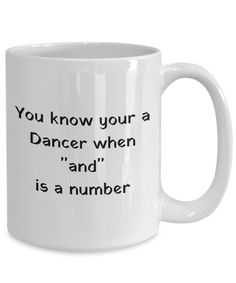 a white coffee mug with the words you know your a dancer when and is a number