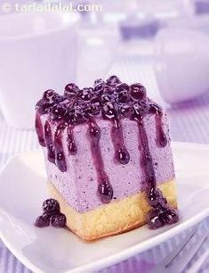 a blueberry cheesecake on a white plate