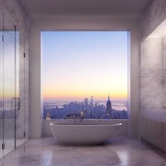 a bathroom with a large window and a bathtub in the center, overlooking a cityscape