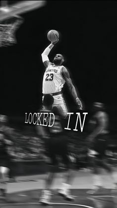 an image of a man playing basketball with the words locked in front of him on it