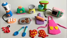 there are many toy kitchen items on the table