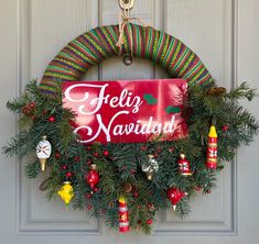 a christmas wreath hanging on a door with the words hello navada written on it