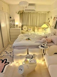 a bed room with a neatly made bed and lots of pillows