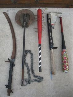 an assortment of old tools are displayed on the floor